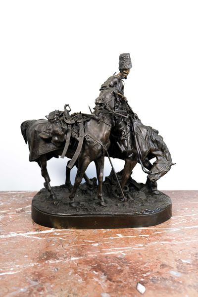 Evgeni Alexandrovich LANCERAY (1848-1886) "Le cosaque de Zaporijia après la bataille" groupe en bronze à patine noire.  42 x 37 cm