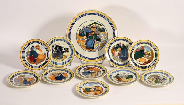 Mathurin MÉHEUT (1882-1958). Service de la Galette comprenant dix assiettes et un plat, en faïence polychrome,