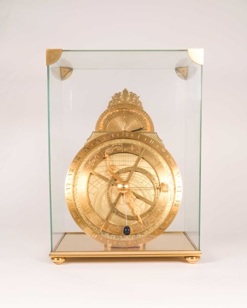 HOUR LAVIGNE, Pendule astrolabe en bronze et laiton. 30,5 x 23 x 15 cm